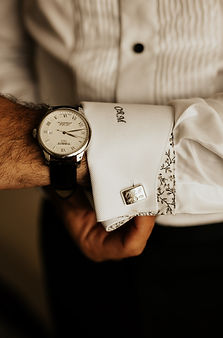 groom getting ready for wedding ceremony, candid fine-art wedding preparation photo in natural light