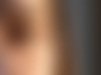 Close-up of a thoughtful woman’s eye in natural light, reflecting quiet fatigue and emotional depth