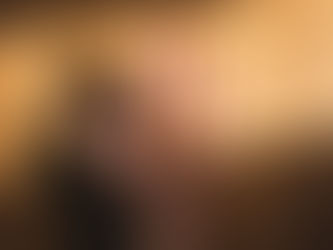 Open palm holding cinnamon over a doorway in soft morning light, symbolizing new beginnings