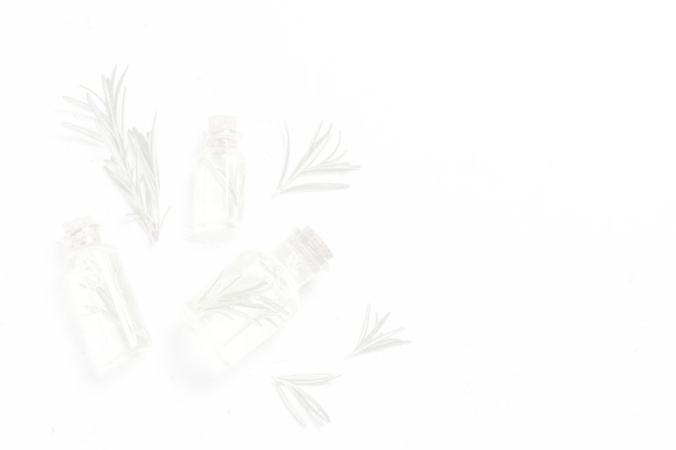 Rosemary oil. Bottle glass with rosemary essential oil and fresh rosemary twig on white ba