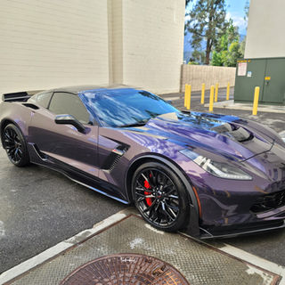 Purple Corvette sports car parked and cleaned near building, Jmobiledetailing