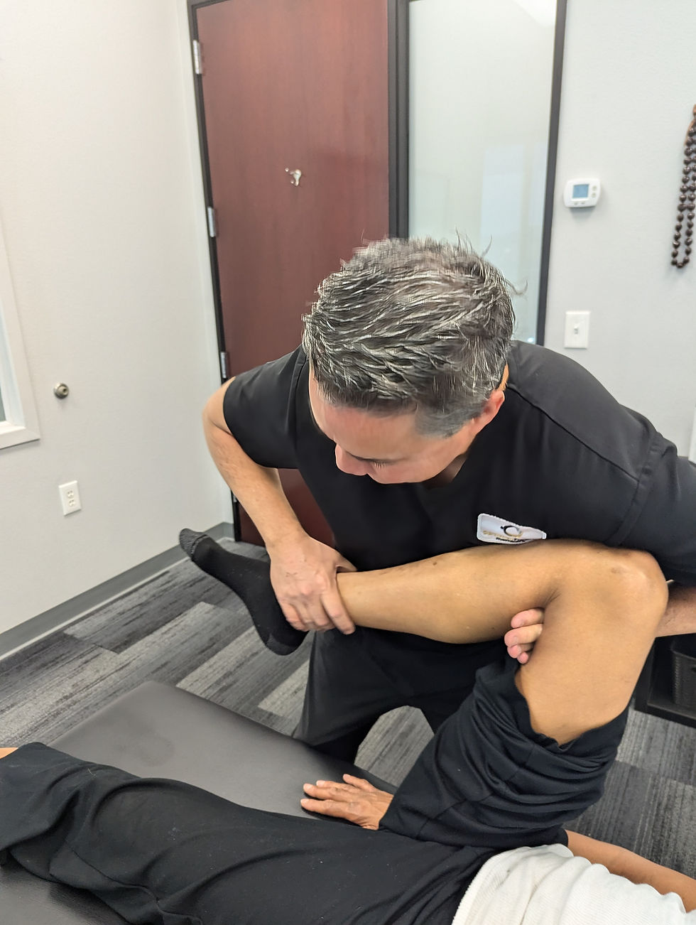 Dr. Chris Colgin performing a knee alignment check