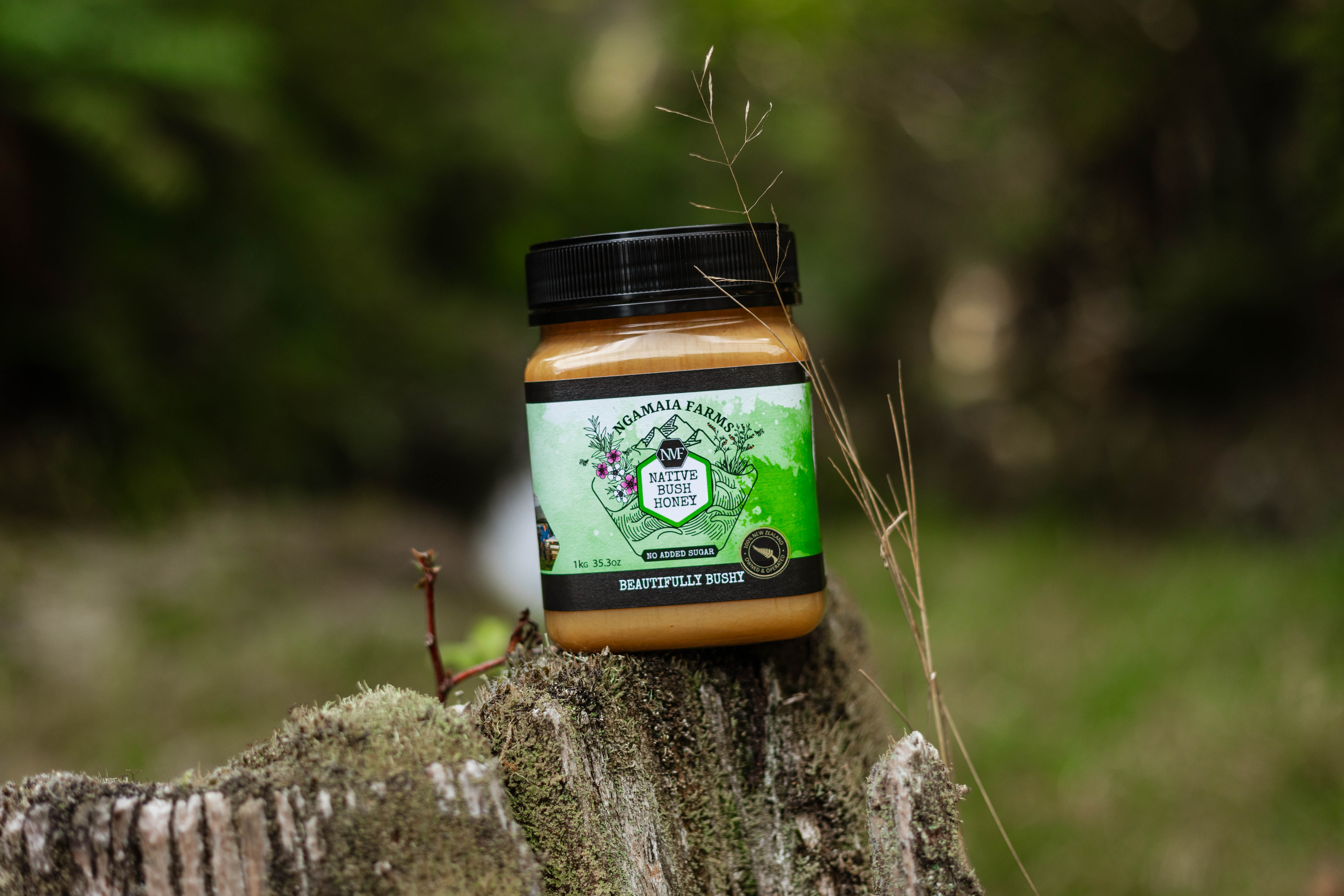 A spoonful of honey being drizzled into a cup of tea