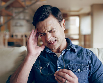 vecteezy_man-stress-or-headache-in-home-with-glasses-sickness-and_77964199.jpg