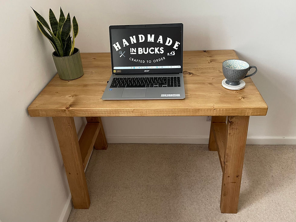 Thumbnail: Rustic chunky handmade desk with timber A-frame legs front view with logo on pc