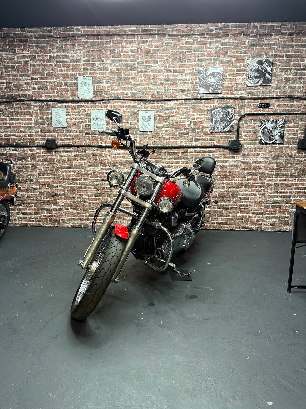 Red Harley Davidson motorcycle in garage