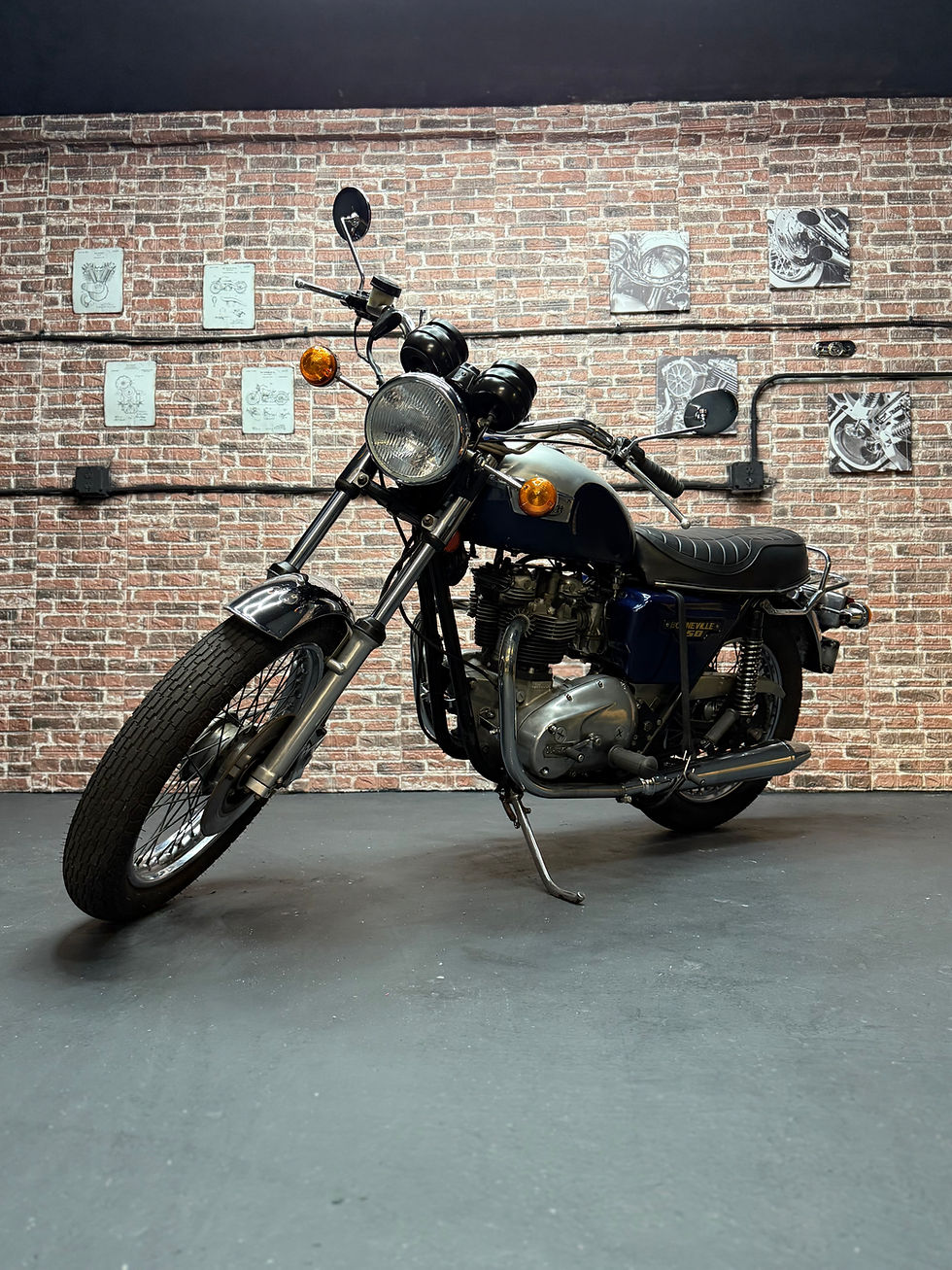 Vintage motorcycle against brick wall