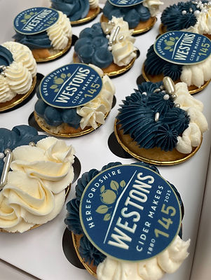 Brand logo Cupcakes, Westons Cider, dark navy and white and gold cucakes
