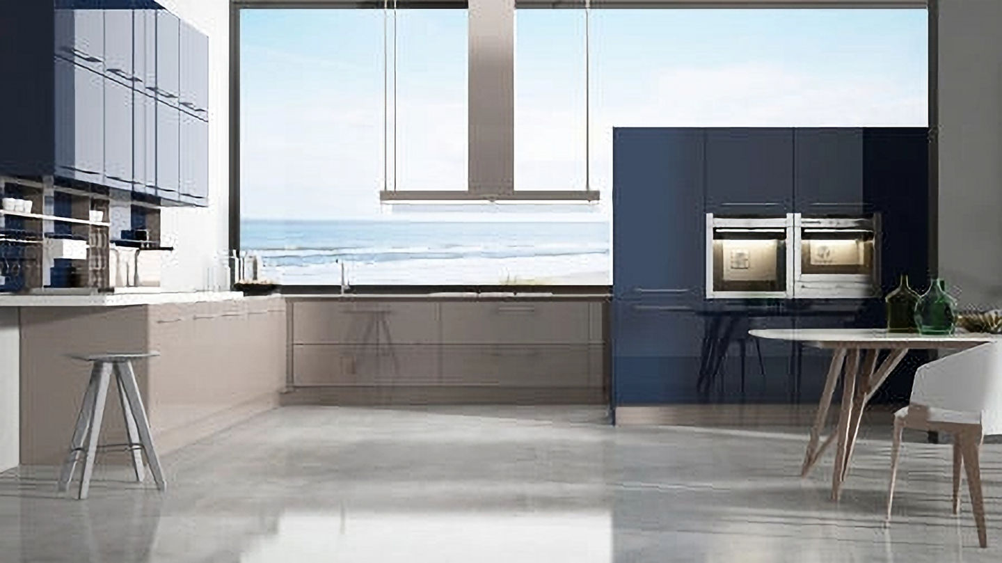 Modern kitchen with blue and beige cabinets overlooking the ocean view.
