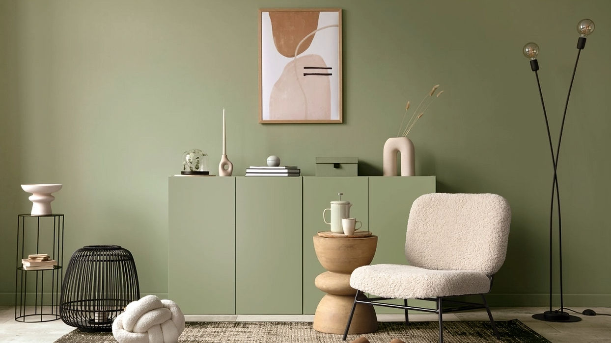 Modern living room design with green wall and decorative cabinet furniture