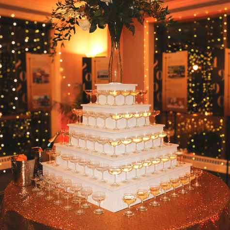 champagne tower in a glittering ballroom