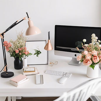 minimalist feminine office with white wall, white desktop, double monitor computer, flower