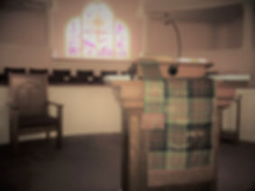The pulpit in he sanctuary of the church displays the tartan assigned to Barbecue that is displayed during homecoming.