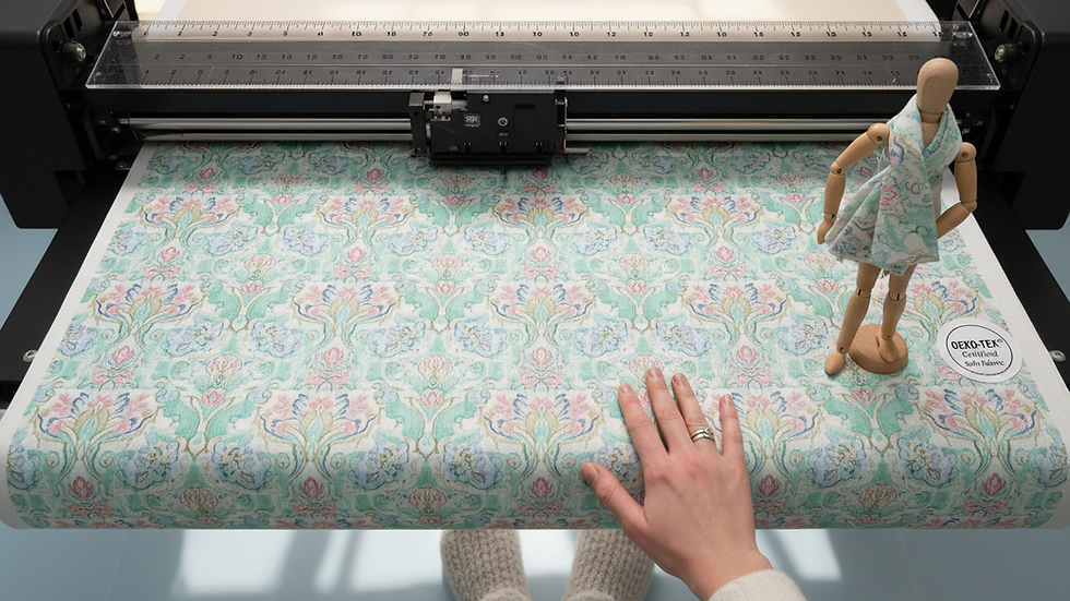 Close-up view of digital textile printer producing vibrant fabric patterns
