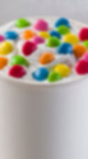 White soft serve with multi-colored candy on top