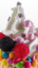 White soft serve with multi-colored candy on top