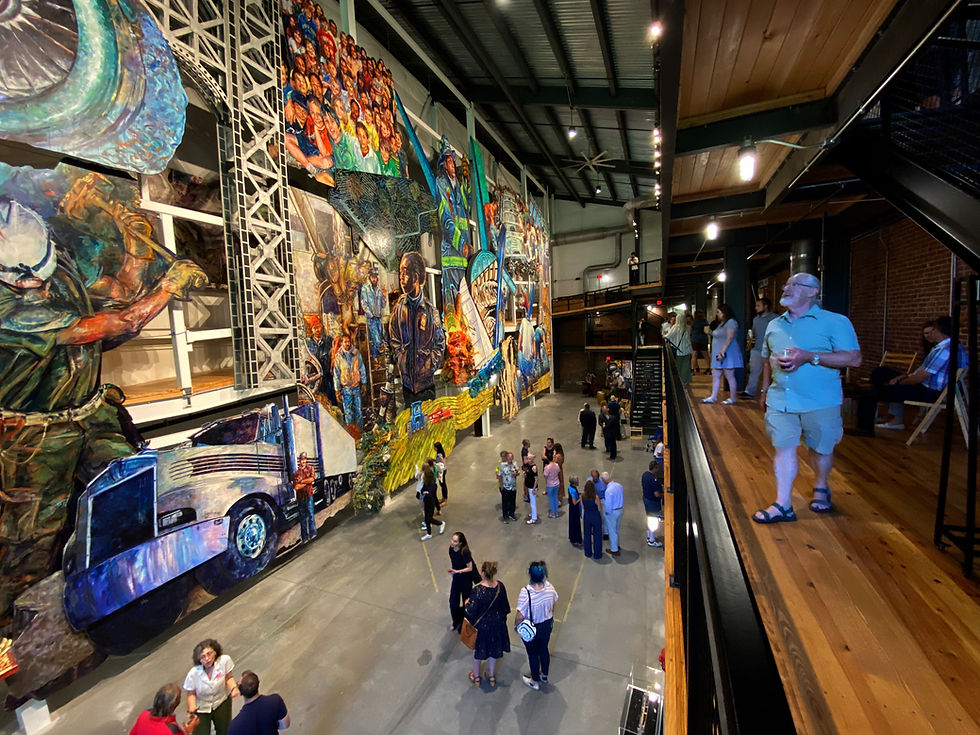 Visitors to the mural, which opened to the public in 2022. Photo courtesy of American Mural Project