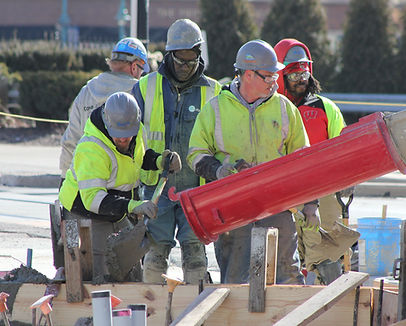 Construction Worker Pouring Concrete