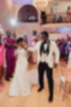 Bride and groom entering reception dancing