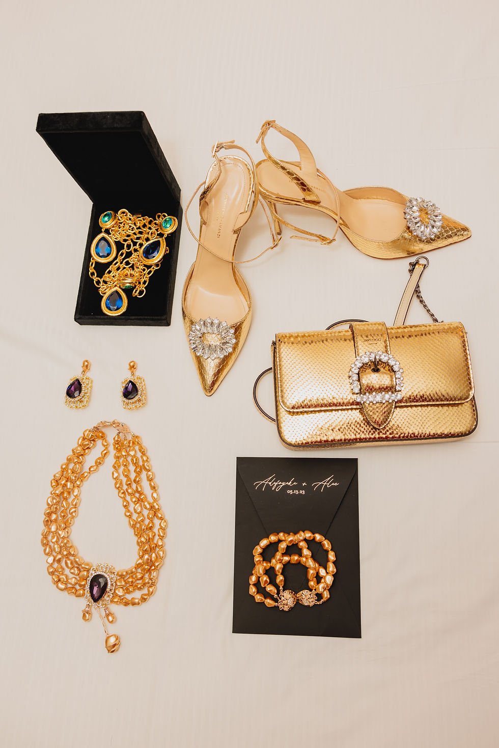 Elegant wedding detail flat lay with gold bridal shoes, jewelry, and accessories, captured by a Columbus Ohio wedding photographer.