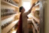 Indian_Woman_Organizing_Kitchen_Pantry_1_1_1.webp