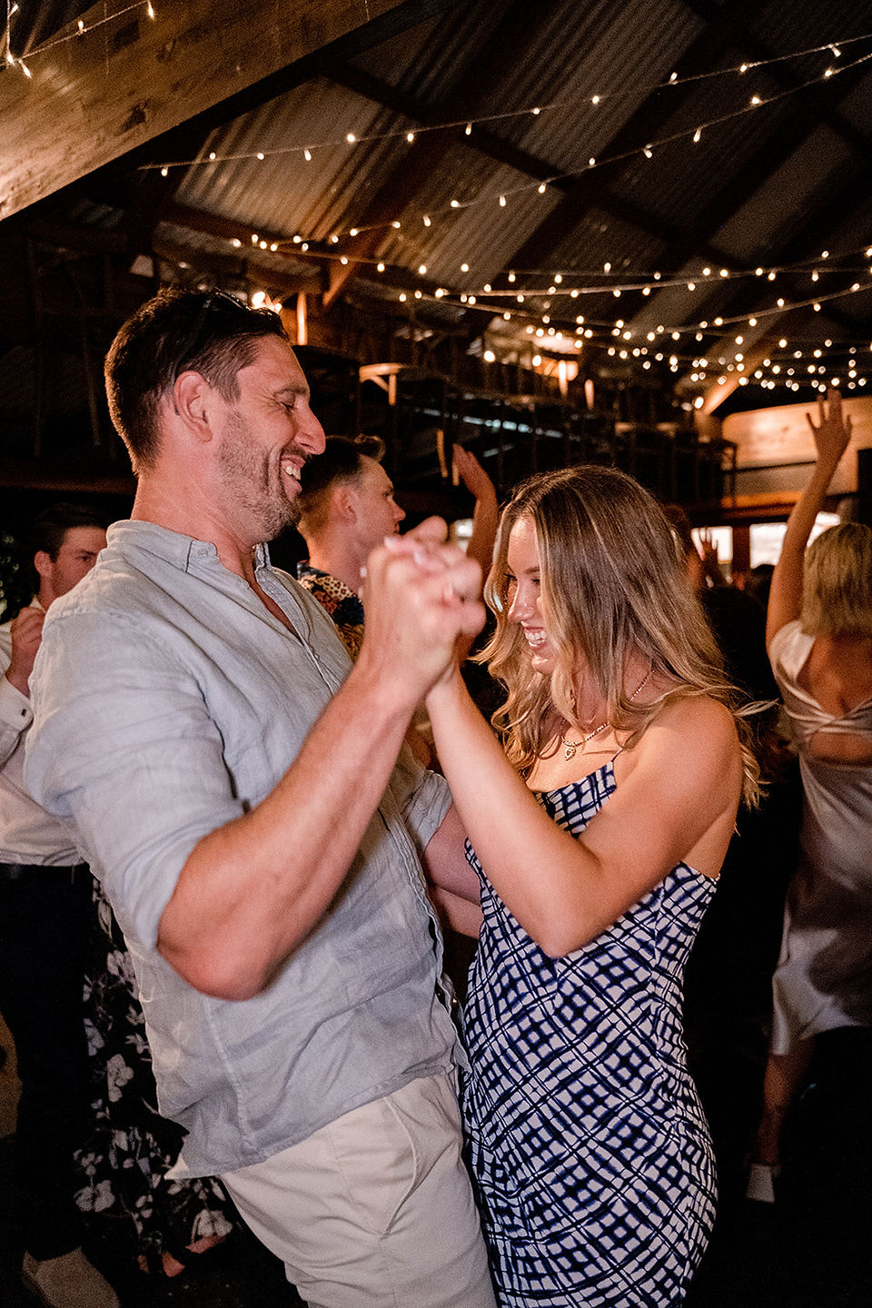 a man and a woman holding hands and dancing at Haylee and Trent's wedding at K1 Winery