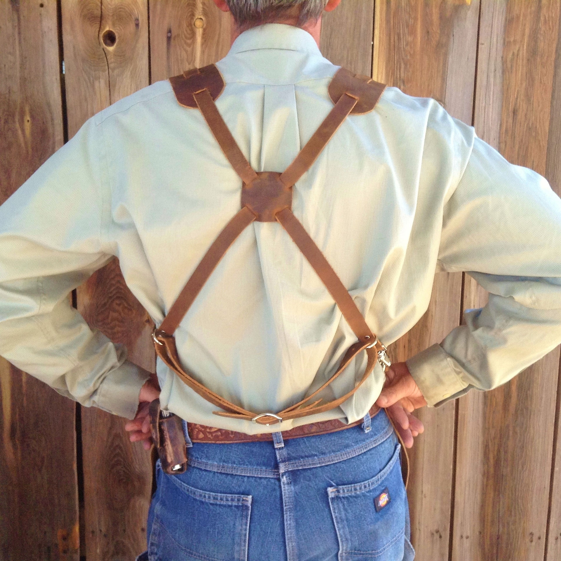 On the X system, he weight of the leather apron is supported mostly from the shoulders. The square piece is adjustable changing how the fit feels.