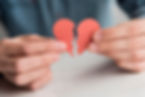 close-up-hands-holding-broken-heart.jpg