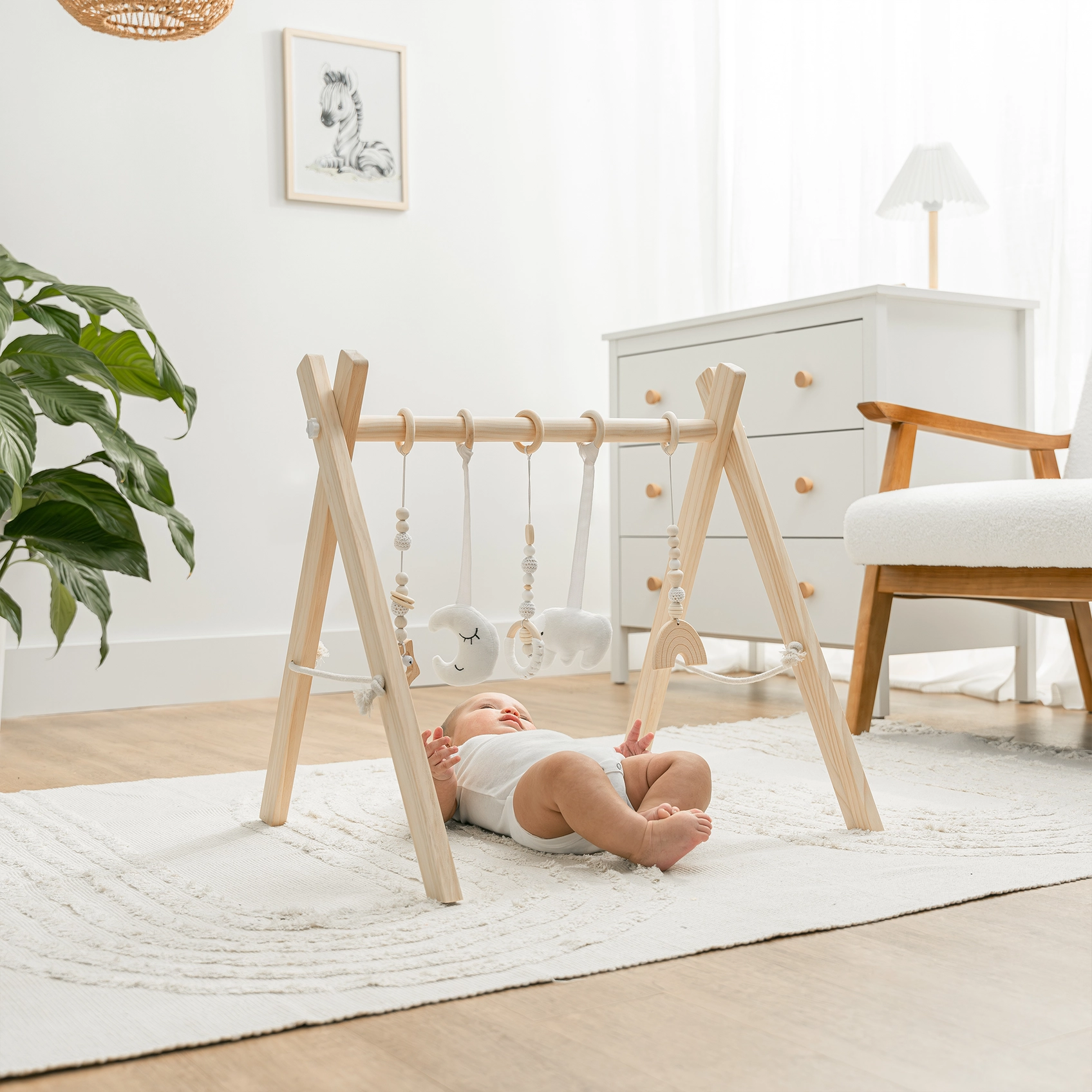 baby playing with play gym