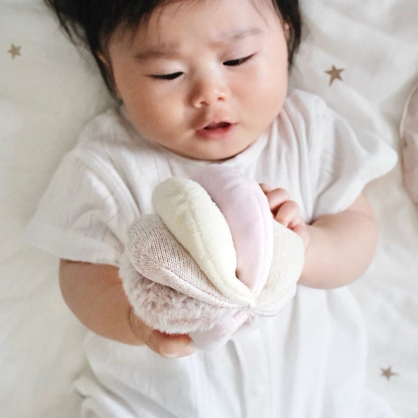 baby looking at sensory ball