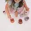 Thumbnail: girl playing with lilac tea set