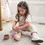 Thumbnail: girl playing with silicone stacking cups