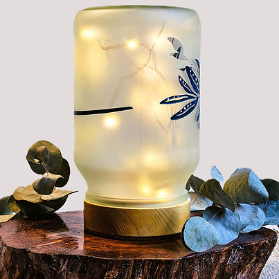 Glass cylinder twinkle light table lamp on timber base with side switch with sandblasted frosty artwork with full wraparound Blue Gum Leave and White Dots on leaves hand painted white and blue side view