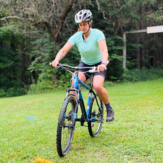 Coach demonstrating bike handling skills