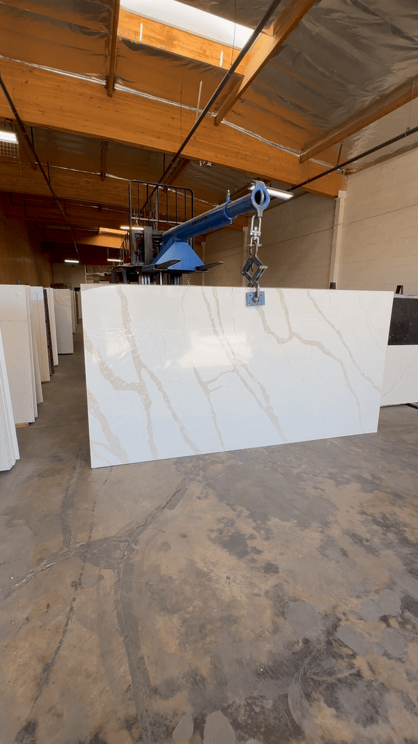Slab image of Calacatta quartz in the indoor warehouse at Verona Quartz Surfaces in Los Angeles