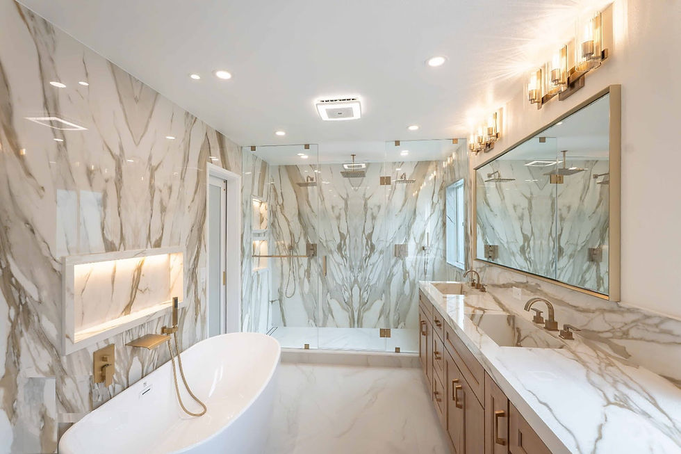 Calacatta Gold Porcelain Slabs Installed Around Shower Walls, Bathroom Countertop And Integrated Sinks Showing Book Matching Slabs That Minimize And Hide Seams
