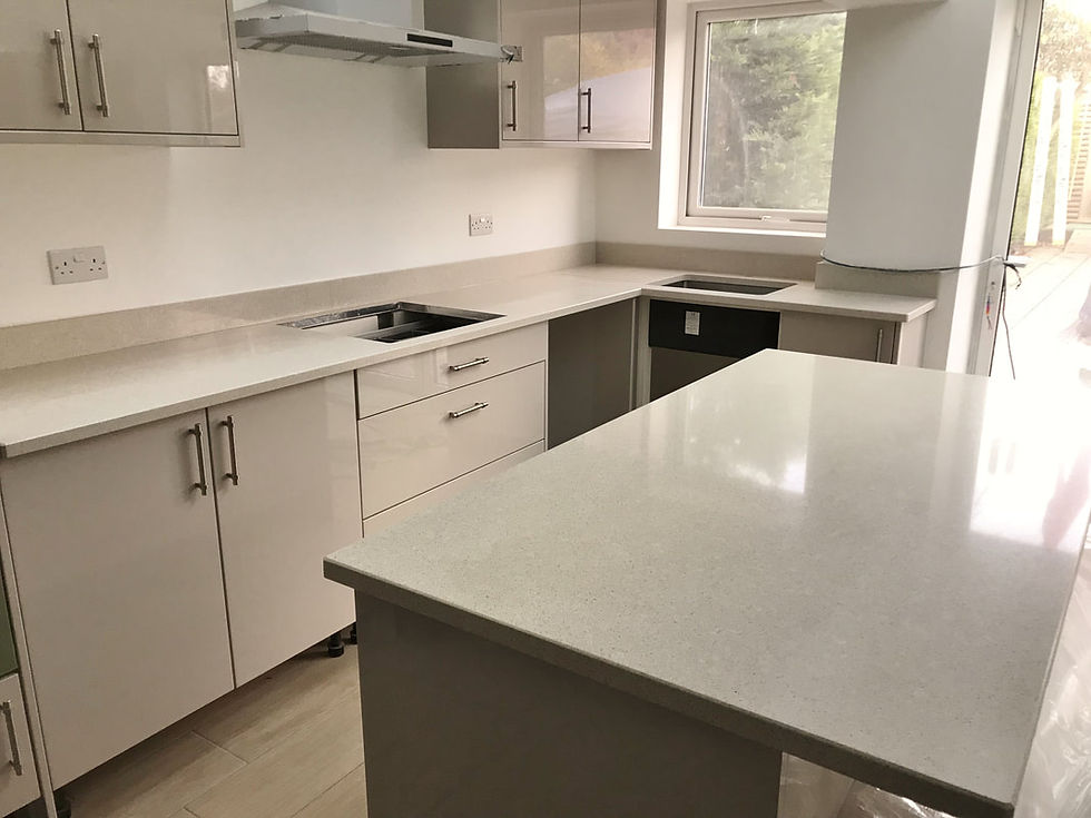 Unique custom kitchen with cream and white colors, featuring crystal beige quartz countertops