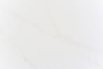Bright white quartz surface with lighting like golden veins