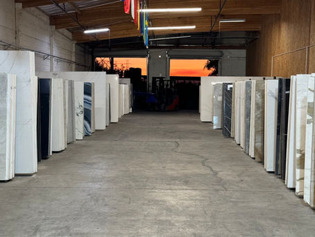 a wide shot of the warehouse showroom with quartz slabs on display