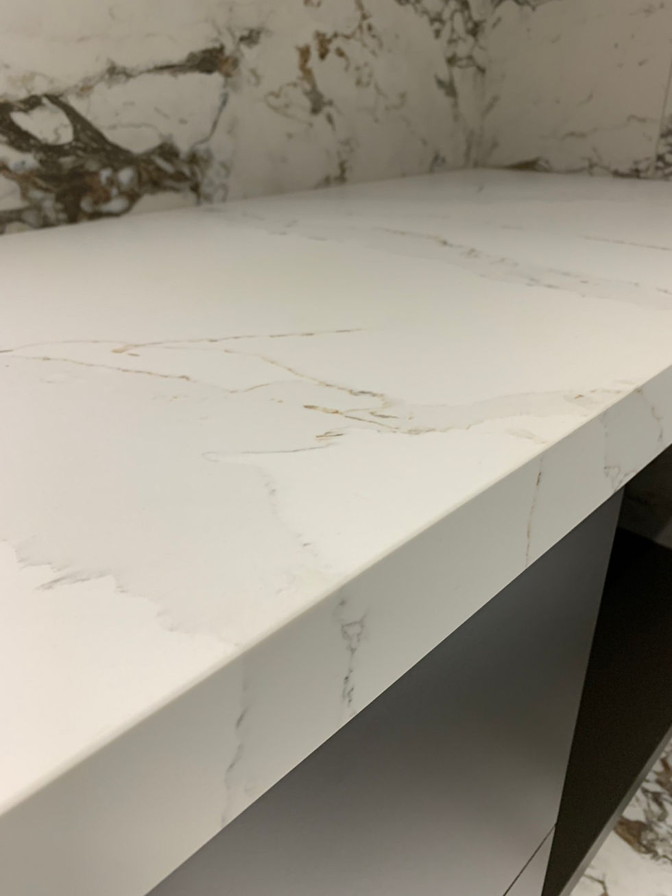 Thumbnail: A counter shot of a delicate veined quartz that resemble calacatta marble