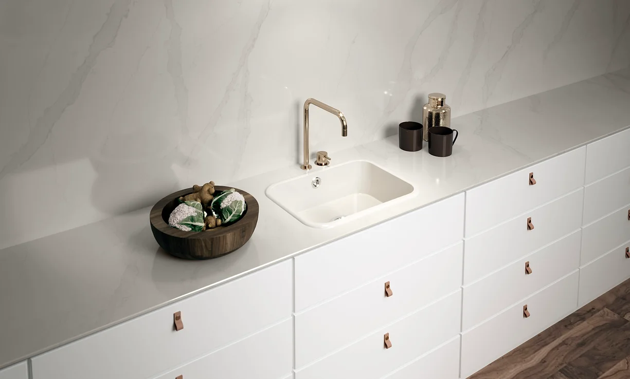 A soft white countertop, with elegant and clean surroundings