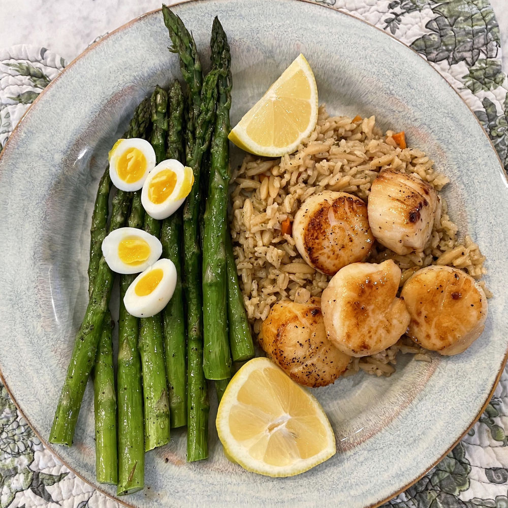 Seared Scallops with Rice, Served with Asparagus with Jammy Quail Eggs