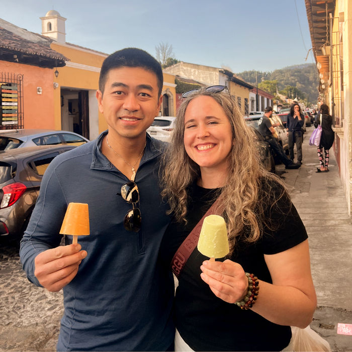 A couple enjoying delicious artisanal ice cream at one of Antigua’s hidden gems, a charming local spot tucked away from the usual tourist paths.