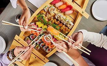 People enjoying catering service from Sushiato