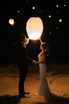 14 Bride and groom releasing a glowing sky lantern at night