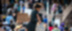 Toddler on man's shoulders holding sign that says My Life Matters