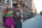 Two African American women standing in front of Brownstone