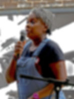 Shawn Batey speaking into microphone