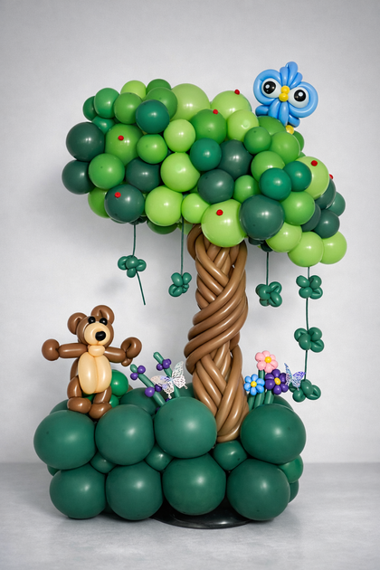 Custom balloon tree sculpture featuring jungle themed elements and animals. A playful and creative balloon decoration perfect for kids birthday parties and themed celebrations in Calgary.
