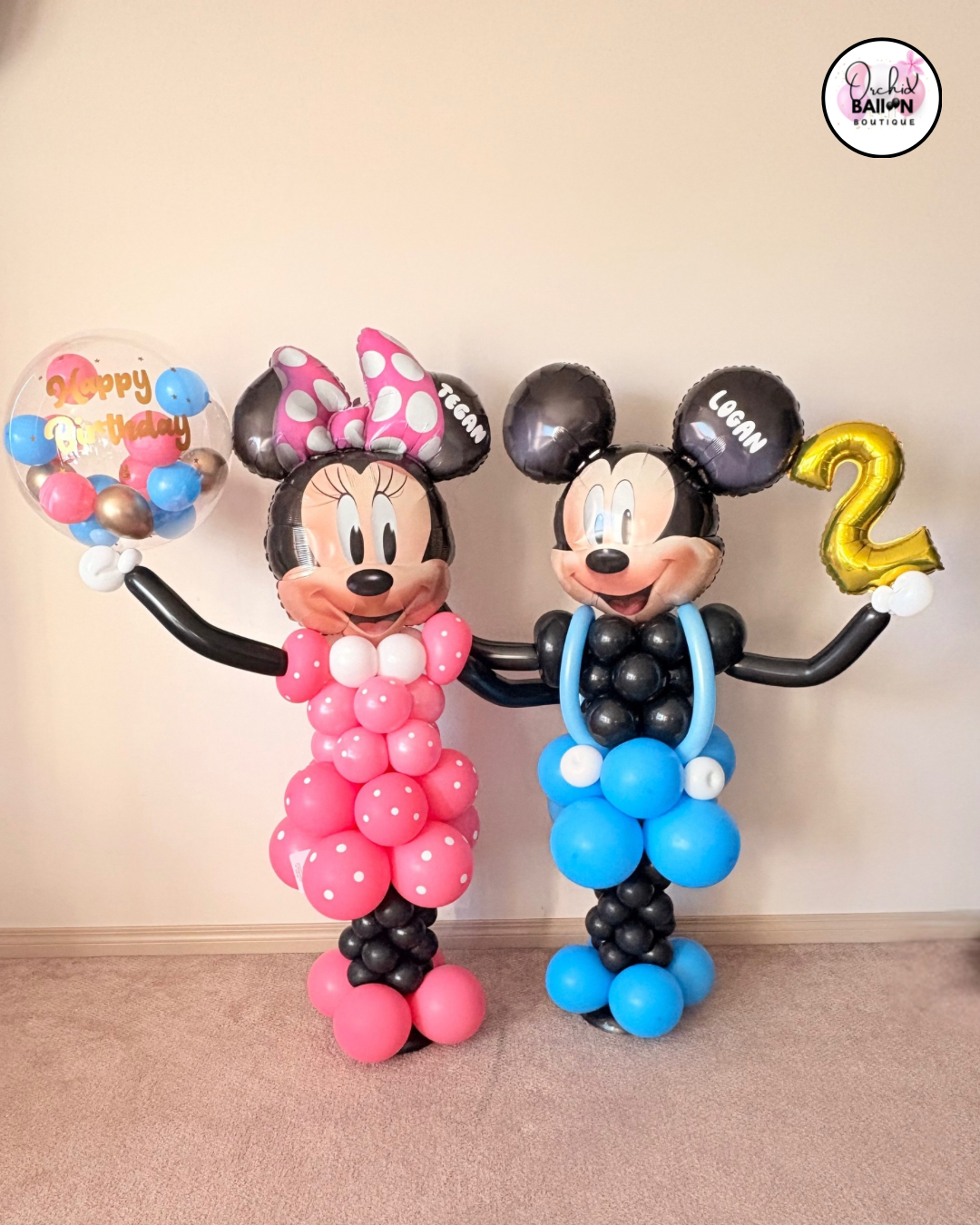 Mickey and Minnie balloon character sculptures for kids birthday party decor in Calgary.